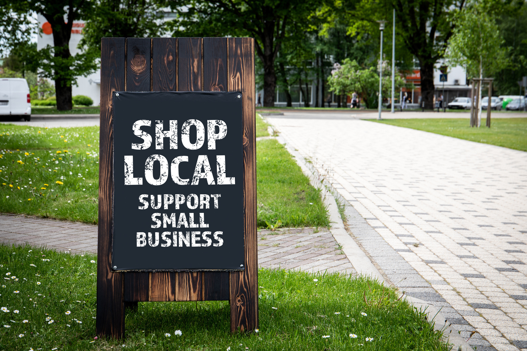A sign encouraging support for local small businesses